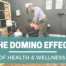 Dr. Joshua gelber adjusting a man. teal block with white letters The domino effect of health and wellness